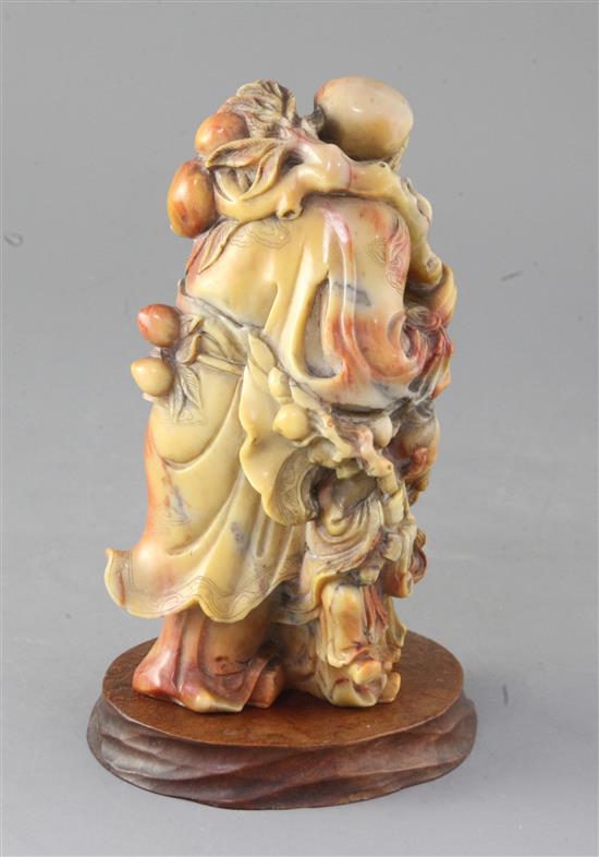 A Chinese soapstone group of an immortal and two attendants, 19th century, 17.5cm high